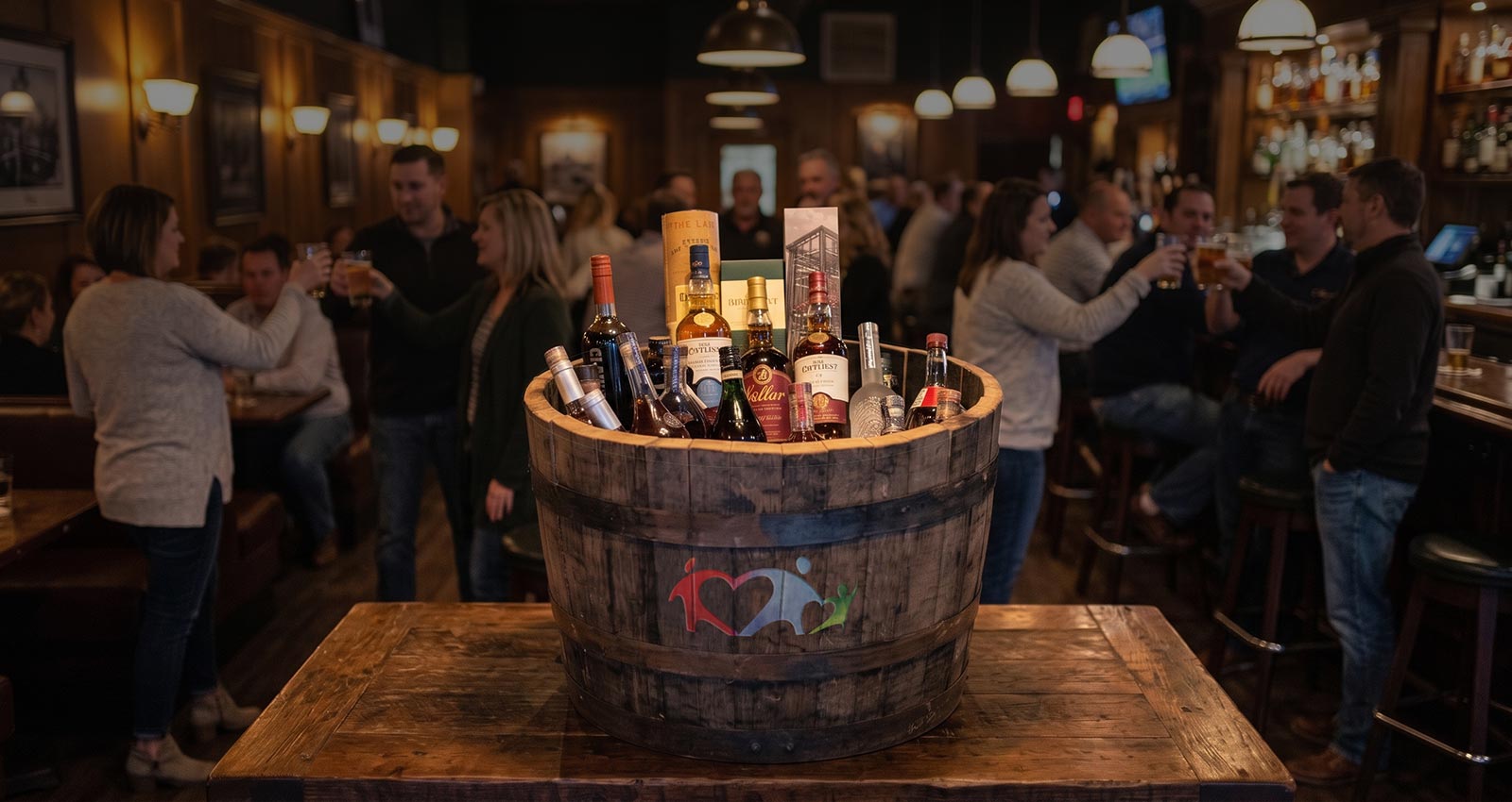 Barrel and bottles on table with PLF logo