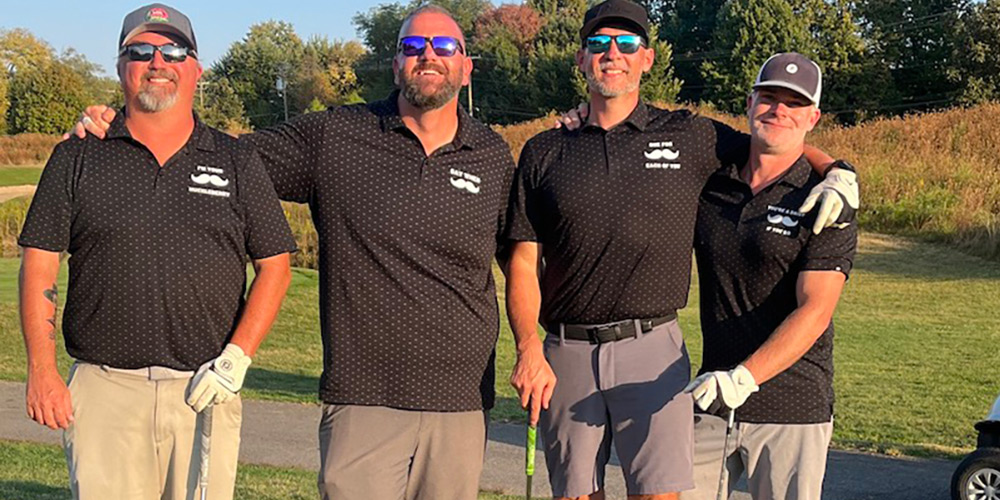 Foursome on golf course